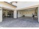 Spacious three car garage with epoxy floors and ample storage, providing both functionality and style at 5218 N Tiller Dr, Litchfield Park, AZ 85340