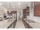 Spacious kitchen with stainless steel appliances, granite countertops, and ample cabinet space at 5218 N Tiller Dr, Litchfield Park, AZ 85340