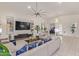 Spacious living room featuring tile flooring, ample seating, and contemporary design elements at 5218 N Tiller Dr, Litchfield Park, AZ 85340