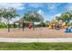 Community playground with swings, covered picnic area, and colorful slides for an active outdoor experience at 5218 N Tiller Dr, Litchfield Park, AZ 85340