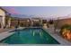Enjoy the refreshing pool with nearby seating for relaxation and entertainment, perfect for outdoor enjoyment at 5218 N Tiller Dr, Litchfield Park, AZ 85340