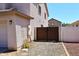 Private backyard features gated access and low-maintenance landscaping at 537 S 153Rd Ln, Goodyear, AZ 85338