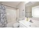 Bright bathroom with white vanity, commode, shower/tub with neutral paint at 537 S 153Rd Ln, Goodyear, AZ 85338