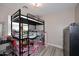 Small bedroom featuring a bunk bed, and luxury vinyl plank flooring and neutral paint at 537 S 153Rd Ln, Goodyear, AZ 85338