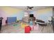 Bright and inviting bonus room with laminate floors and vibrant, colorful decor is perfect for activities at 537 S 153Rd Ln, Goodyear, AZ 85338
