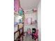 Walk-in closet with built-in shelving for storage and organization at 537 S 153Rd Ln, Goodyear, AZ 85338