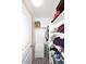 Walk-in closet with shelving units, showing ample storage space for clothing and accessories at 537 S 153Rd Ln, Goodyear, AZ 85338