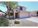 Charming two-story home features a spacious driveway and well-maintained desert landscaping at 537 S 153Rd Ln, Goodyear, AZ 85338