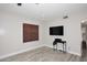 An airy living room boasting modern flooring, a sleek TV setup, and neutral-colored walls at 537 S 153Rd Ln, Goodyear, AZ 85338