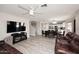 Spacious living room features a dining area, hard surface floors, and a ceiling fan at 537 S 153Rd Ln, Goodyear, AZ 85338
