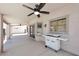 Covered patio featuring ceiling fans and white grill at 537 S 153Rd Ln, Goodyear, AZ 85338