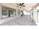 Covered patio with ceiling fans, a grill and view of fenced pool at 537 S 153Rd Ln, Goodyear, AZ 85338