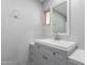 Bright bathroom featuring a modern vanity with gray cabinetry and a white countertop and sink at 5436 E Aspen E Ave, Mesa, AZ 85206