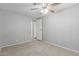 This bedroom has neutral carpet, white ceiling fan, closet and walls at 5436 E Aspen E Ave, Mesa, AZ 85206