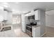 Modern kitchen featuring stainless steel appliances, white cabinets, and granite countertops, perfect for cooking at 5436 E Aspen E Ave, Mesa, AZ 85206