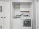 Laundry room with a white washer and dryer at 5436 E Aspen E Ave, Mesa, AZ 85206