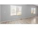 Bright living room showcasing new floors and large windows that fill the room with natural light at 5436 E Aspen E Ave, Mesa, AZ 85206
