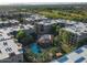Aerial view showcasing community buildings, swimming pool, lush landscaping, and the surrounding area at 5450 E Deer Valley Dr # 2191, Phoenix, AZ 85054