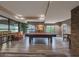 Billiard room boasts a pool table, a sofa, bar stools, and a view of the exterior at 5450 E Deer Valley Dr # 2191, Phoenix, AZ 85054