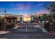 Inviting community entrance with stone accents, landscaping, and a peek of the neighborhood beyond at 5450 E Deer Valley Dr # 2191, Phoenix, AZ 85054