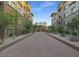 Elegant building featuring stone accents, balconies, and lush landscaping, creating a welcoming facade at 5450 E Deer Valley Dr # 2191, Phoenix, AZ 85054