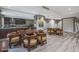 Stylish kitchen and dining area with seating, dark wood cabinets, and modern appliances at 5450 E Deer Valley Dr # 2191, Phoenix, AZ 85054