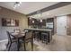 Eat-in kitchen featuring dark cabinets, stainless appliances and granite countertops at 5450 E Deer Valley Dr # 2191, Phoenix, AZ 85054