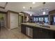 Open-concept kitchen with stainless steel appliances and a breakfast bar with pendant lighting at 5450 E Deer Valley Dr # 2191, Phoenix, AZ 85054