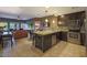 Spacious kitchen with stainless steel appliances, an island with seating, and an open living area at 5450 E Deer Valley Dr # 2191, Phoenix, AZ 85054