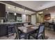 Kitchen with stainless steel appliances, dark cabinetry, and adjacent dining area at 5450 E Deer Valley Dr # 2191, Phoenix, AZ 85054