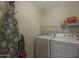 Functional laundry room with a washer, dryer, and ironing board, making laundry day easier at 5450 E Deer Valley Dr # 2191, Phoenix, AZ 85054