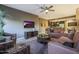 Cozy living room with comfortable seating, ceiling fan, and television for relaxing evenings at 5450 E Deer Valley Dr # 2191, Phoenix, AZ 85054
