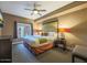 Comfortable main bedroom featuring a king bed, large window, and decorative lamps at 5450 E Deer Valley Dr # 2191, Phoenix, AZ 85054