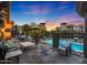 Stunning pool area with comfortable seating and umbrellas overlooking neighboring building at 5450 E Deer Valley Dr # 2191, Phoenix, AZ 85054