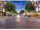 Lively street with trees, outdoor dining, decorative lighting, and shops at 5450 E Deer Valley Dr # 2191, Phoenix, AZ 85054