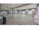 Bright yoga studio with hardwood floors, mirrored wall, and storage shelves for equipment at 5450 E Deer Valley Dr # 2191, Phoenix, AZ 85054