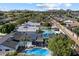 Aerial view of homes showcasing sparkling pools and lush landscaping, nestled in a vibrant neighborhood with mountain views at 5707 N 12Th Pl, Phoenix, AZ 85014