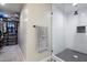 Modern bathroom features walk-in shower, neutral decor, and adjacent walk-in closet at 5707 N 12Th Pl, Phoenix, AZ 85014