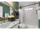 Charming bathroom with white subway tile, floating wood shelves, and a marble countertop at 5707 N 12Th Pl, Phoenix, AZ 85014