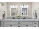 Bright bathroom with double sinks, marble countertops, and modern fixtures at 5707 N 12Th Pl, Phoenix, AZ 85014