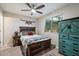 Bedroom decorated with reclaimed wood furnishings and colorful turquoise accents at 5707 N 12Th Pl, Phoenix, AZ 85014