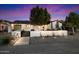 Charming home with modern landscaping, decorative wall, and trees providing excellent curb appeal at 5707 N 12Th Pl, Phoenix, AZ 85014