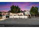 Charming home with modern landscaping, decorative wall, and trees providing curb appeal at 5707 N 12Th Pl, Phoenix, AZ 85014
