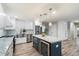 Bright kitchen features custom cabinets, marble countertops, stainless steel appliances, and a wine fridge at 5707 N 12Th Pl, Phoenix, AZ 85014