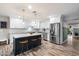 Modern kitchen with stainless steel appliances, marble countertops, and a center island with seating at 5707 N 12Th Pl, Phoenix, AZ 85014