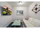Cozy Gathering room features a comfortable white sofa, tv, and modern decor at 5707 N 12Th Pl, Phoenix, AZ 85014