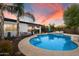 Relaxing backyard featuring a sparkling blue pool, lush landscaping, and comfortable lounge seating at 5707 N 12Th Pl, Phoenix, AZ 85014