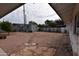 Large backyard with gravel, shed, stepping stones, and potential garden area at 5720 E University Dr, Mesa, AZ 85205