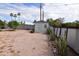 The backyard features a storage shed, desert landscaping, and a privacy fence at 5720 E University Dr, Mesa, AZ 85205
