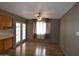Dining area showcasing laminate floors, french doors, and a ceiling fan at 5720 E University Dr, Mesa, AZ 85205